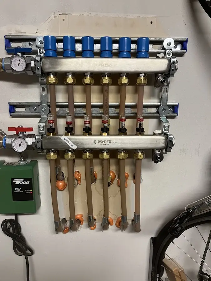 Plumber performing Gas Line Installation at a residential property in Oak Bluffs